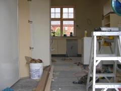 Standing in the new french doors, looking back through the dining nook to the new kitchen work area